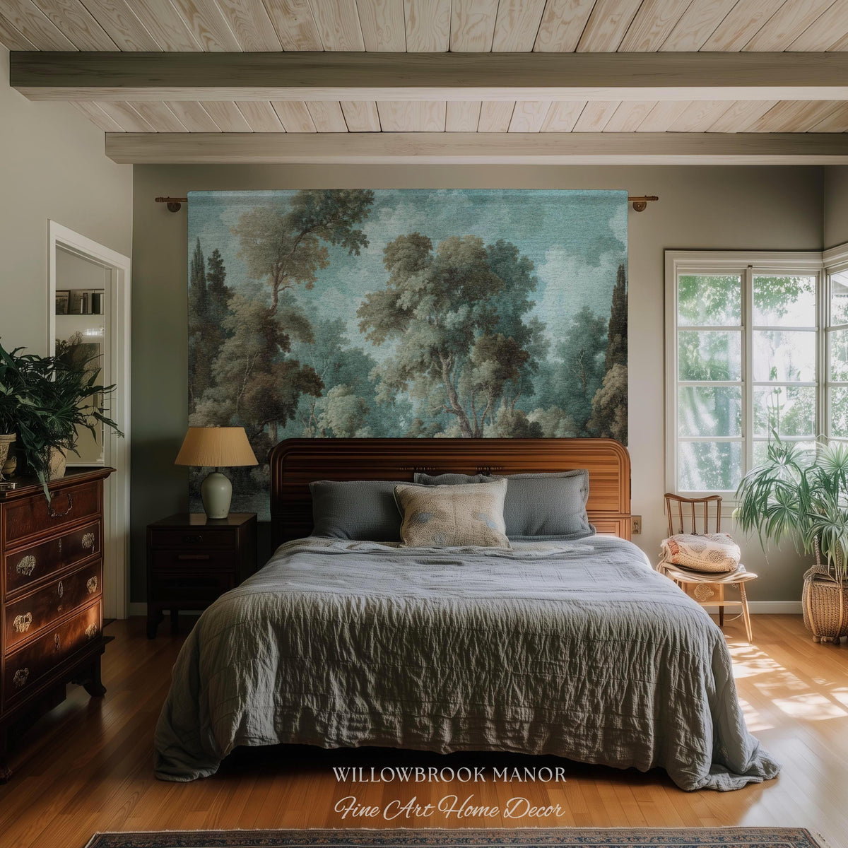 May include: A bedroom scene featuring a large tapestry with a forest landscape design above a wooden bed frame. The bed is covered with a gray comforter and pillows. The room has wooden floors and a dresser.